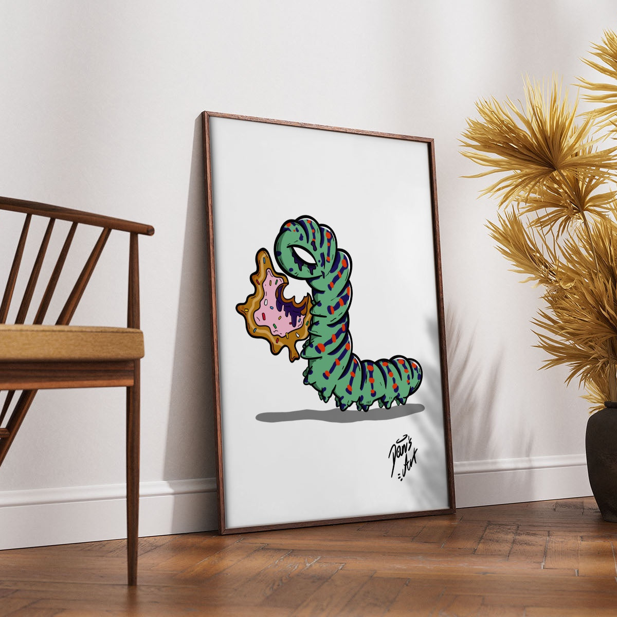 Illustration of a donut-shaped caterpillar eating a donut-style leaf.